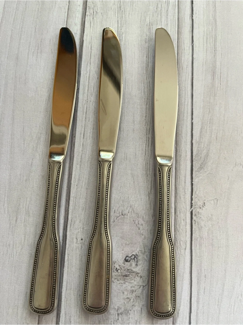 One set of 3 vintage Salem 1776 stainless steel beaded edge butter knives.
